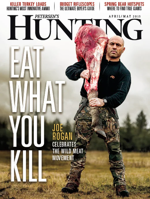 Petersen's Hunting cover, April/May 2015: Joe Rogan carrying a moose quarter under the cover line 'Eat What You Kill'